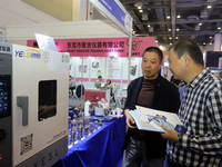 Visitors attend the 14th China International Nanotechnology Industry Expo in Suzhou, China, on October 23, 2024. (