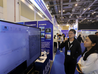 Visitors attend the 14th China International Nanotechnology Industry Expo in Suzhou, China, on October 23, 2024. (