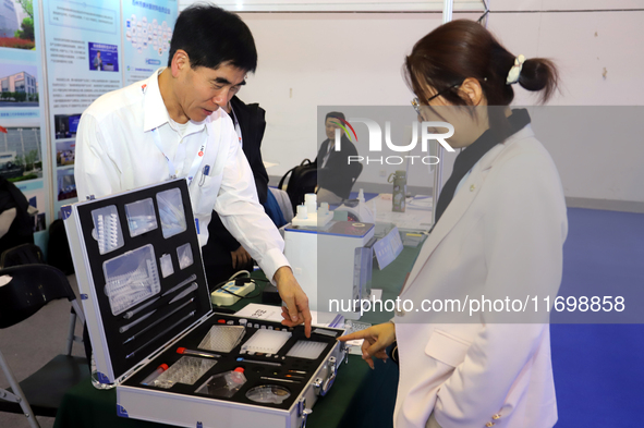 Visitors attend the 14th China International Nanotechnology Industry Expo in Suzhou, China, on October 23, 2024. 