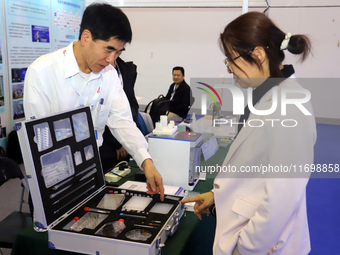 Visitors attend the 14th China International Nanotechnology Industry Expo in Suzhou, China, on October 23, 2024. (