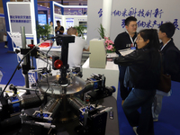 Visitors attend the 14th China International Nanotechnology Industry Expo in Suzhou, China, on October 23, 2024. (