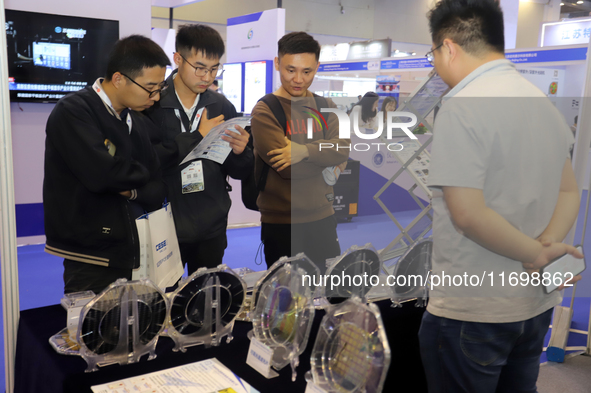 Visitors attend the 14th China International Nanotechnology Industry Expo in Suzhou, China, on October 23, 2024. 