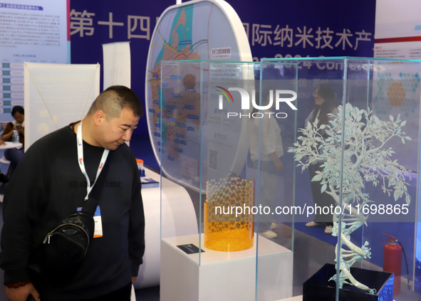 Visitors attend the 14th China International Nanotechnology Industry Expo in Suzhou, China, on October 23, 2024. 