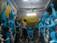 Artists give final touches to idols of Goddess Kali ahead of the Kali Puja festival in Kolkata, India, on October 23, 2024. (