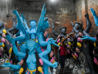 Artists give final touches to idols of Goddess Kali ahead of the Kali Puja festival in Kolkata, India, on October 23, 2024. (