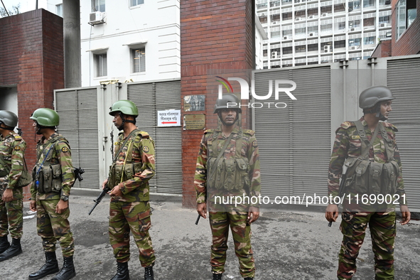 Bangladesh army soldiers stand guard in front of the Secretariat as HSC (Higher Secondary Certificate) students, who fail or receive poor re...