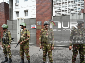 Bangladesh army soldiers stand guard in front of the Secretariat as HSC (Higher Secondary Certificate) students, who fail or receive poor re...