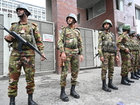 Bangladesh army soldiers stand guard in front of the Secretariat as HSC (Higher Secondary Certificate) students, who fail or receive poor re...