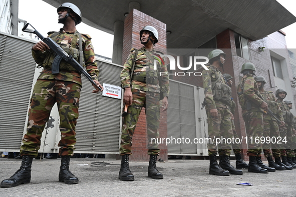 Bangladesh army soldiers stand guard in front of the Secretariat as HSC (Higher Secondary Certificate) students, who fail or receive poor re...