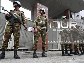 Bangladesh army soldiers stand guard in front of the Secretariat as HSC (Higher Secondary Certificate) students, who fail or receive poor re...