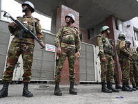 Bangladesh army soldiers stand guard in front of the Secretariat as HSC (Higher Secondary Certificate) students, who fail or receive poor re...