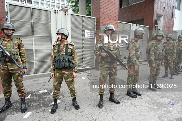 Bangladesh army soldiers stand guard in front of the Secretariat as HSC (Higher Secondary Certificate) students, who fail or receive poor re...