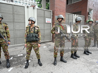 Bangladesh army soldiers stand guard in front of the Secretariat as HSC (Higher Secondary Certificate) students, who fail or receive poor re...