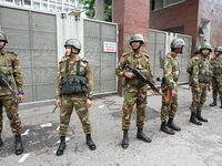 Bangladesh army soldiers stand guard in front of the Secretariat as HSC (Higher Secondary Certificate) students, who fail or receive poor re...