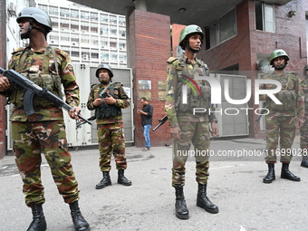 Bangladesh army soldiers stand guard in front of the Secretariat as HSC (Higher Secondary Certificate) students, who fail or receive poor re...