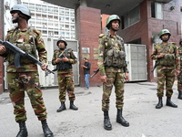 Bangladesh army soldiers stand guard in front of the Secretariat as HSC (Higher Secondary Certificate) students, who fail or receive poor re...