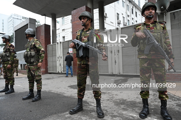 Bangladesh army soldiers stand guard in front of the Secretariat as HSC (Higher Secondary Certificate) students, who fail or receive poor re...