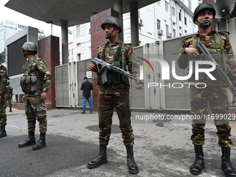 Bangladesh army soldiers stand guard in front of the Secretariat as HSC (Higher Secondary Certificate) students, who fail or receive poor re...