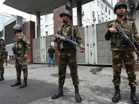 Bangladesh army soldiers stand guard in front of the Secretariat as HSC (Higher Secondary Certificate) students, who fail or receive poor re...