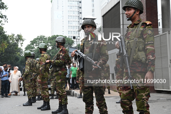 Bangladesh army soldiers stand guard in front of the Secretariat as HSC (Higher Secondary Certificate) students, who fail or receive poor re...