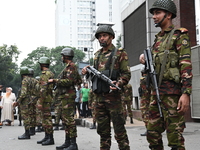 Bangladesh army soldiers stand guard in front of the Secretariat as HSC (Higher Secondary Certificate) students, who fail or receive poor re...