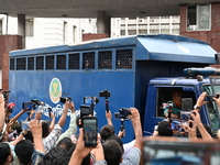 Prison vans transport students after police detain over 50 students for questioning from the Secretariat in Dhaka, Bangladesh, on October 23...