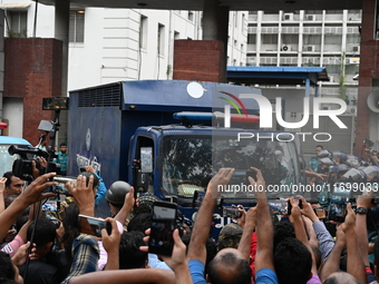 Prison vans transport students after police detain over 50 students for questioning from the Secretariat in Dhaka, Bangladesh, on October 23...