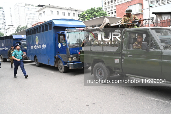 Prison vans transport students after police detain over 50 students for questioning from the Secretariat in Dhaka, Bangladesh, on October 23...