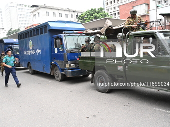 Prison vans transport students after police detain over 50 students for questioning from the Secretariat in Dhaka, Bangladesh, on October 23...