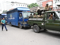 Prison vans transport students after police detain over 50 students for questioning from the Secretariat in Dhaka, Bangladesh, on October 23...