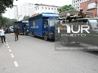 Prison vans transport students after police detain over 50 students for questioning from the Secretariat in Dhaka, Bangladesh, on October 23...