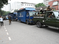 Prison vans transport students after police detain over 50 students for questioning from the Secretariat in Dhaka, Bangladesh, on October 23...