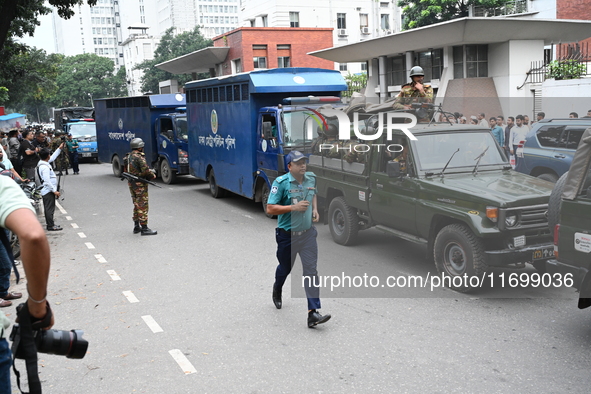 Prison vans transport students after police detain over 50 students for questioning from the Secretariat in Dhaka, Bangladesh, on October 23...