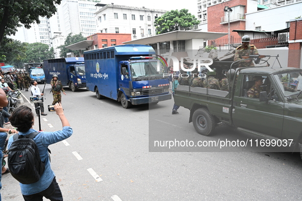 Prison vans transport students after police detain over 50 students for questioning from the Secretariat in Dhaka, Bangladesh, on October 23...