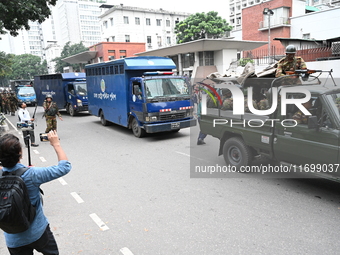 Prison vans transport students after police detain over 50 students for questioning from the Secretariat in Dhaka, Bangladesh, on October 23...