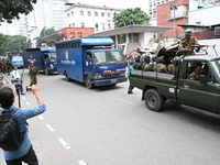 Prison vans transport students after police detain over 50 students for questioning from the Secretariat in Dhaka, Bangladesh, on October 23...