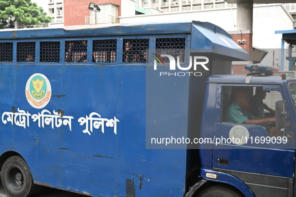 Prison vans transport students after police detain over 50 students for questioning from the Secretariat in Dhaka, Bangladesh, on October 23...