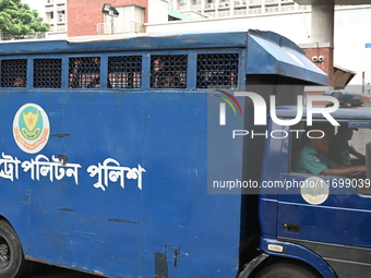 Prison vans transport students after police detain over 50 students for questioning from the Secretariat in Dhaka, Bangladesh, on October 23...