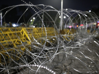 Army personnel stand guard in front of the Bangabhaban, the residence and workplace of President Mohammed Shahabuddin, after protesters dema...