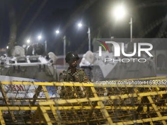 Army personnel stand guard in front of the Bangabhaban, the residence and workplace of President Mohammed Shahabuddin, after protesters dema...