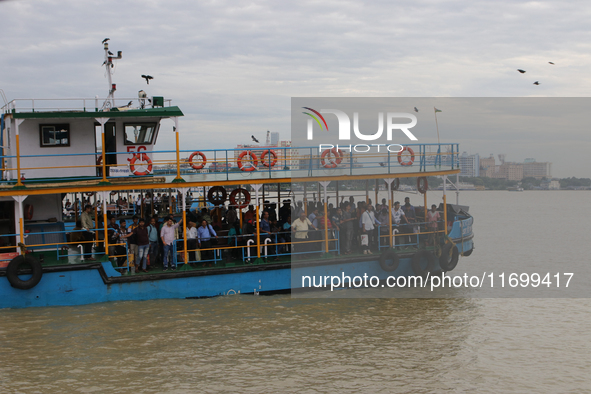 A passenger ferry sails along the river Hooghly in Kolkata, India, on October 23, 2024. 