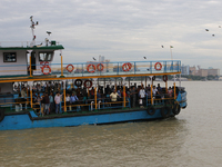 A passenger ferry sails along the river Hooghly in Kolkata, India, on October 23, 2024. (