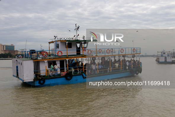 A passenger ferry sails along the river Hooghly in Kolkata, India, on October 23, 2024. 