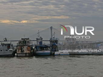 Boats park on the Hooghly River due to Cyclone Dana in Kolkata, India, on October 23, 2024. (