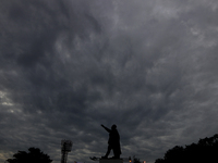 Dark clouds loom over the sky due to Cyclone Dana in India on October 23, 2024. The IMD predicts on Wednesday that the storm brings heavy ra...