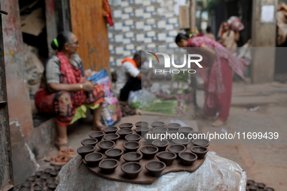 Earthen lamps lay out in the sun to dry at Kumbharwada potter's colony of Dharavi slum in preparation for Diwali (Hindu festival of lights),...