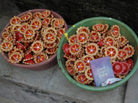 Coloured diyas (earthen lamps) are kept in a storage container at Kumbharwada potter's colony of Dharavi slum in preparation for Diwali (Hin...