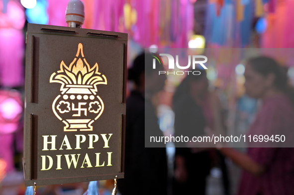 People shop for lanterns at a market ahead of the Hindu festival of Diwali in Mumbai, India, on October 23, 2024. 