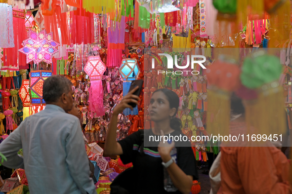 People shop for lanterns at a market ahead of the Hindu festival of Diwali in Mumbai, India, on October 23, 2024. 