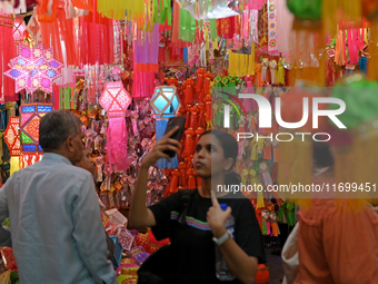 People shop for lanterns at a market ahead of the Hindu festival of Diwali in Mumbai, India, on October 23, 2024. (